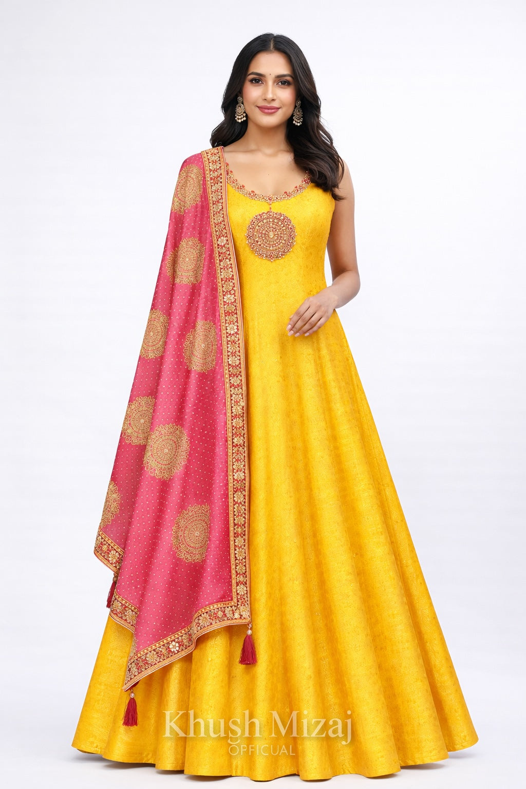 Woman wearing a yellow dress with a pink dupatta featuring gold patterns on a white background, branded 'Khush Mizaj'.