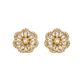 Pair of gold floral earrings with clear gemstones on a white background