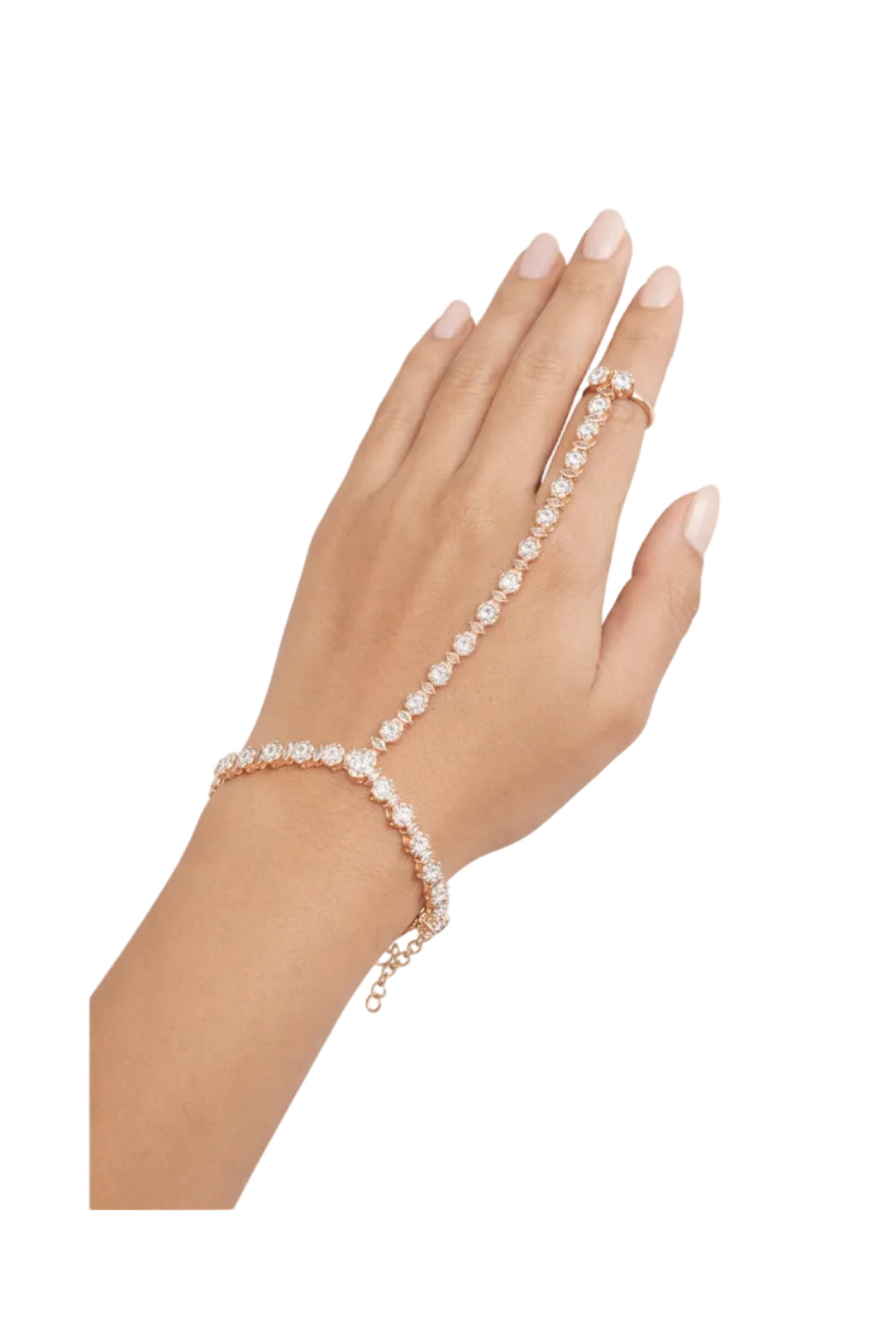 Hand wearing a rose gold bracelet with clear stones on a white background